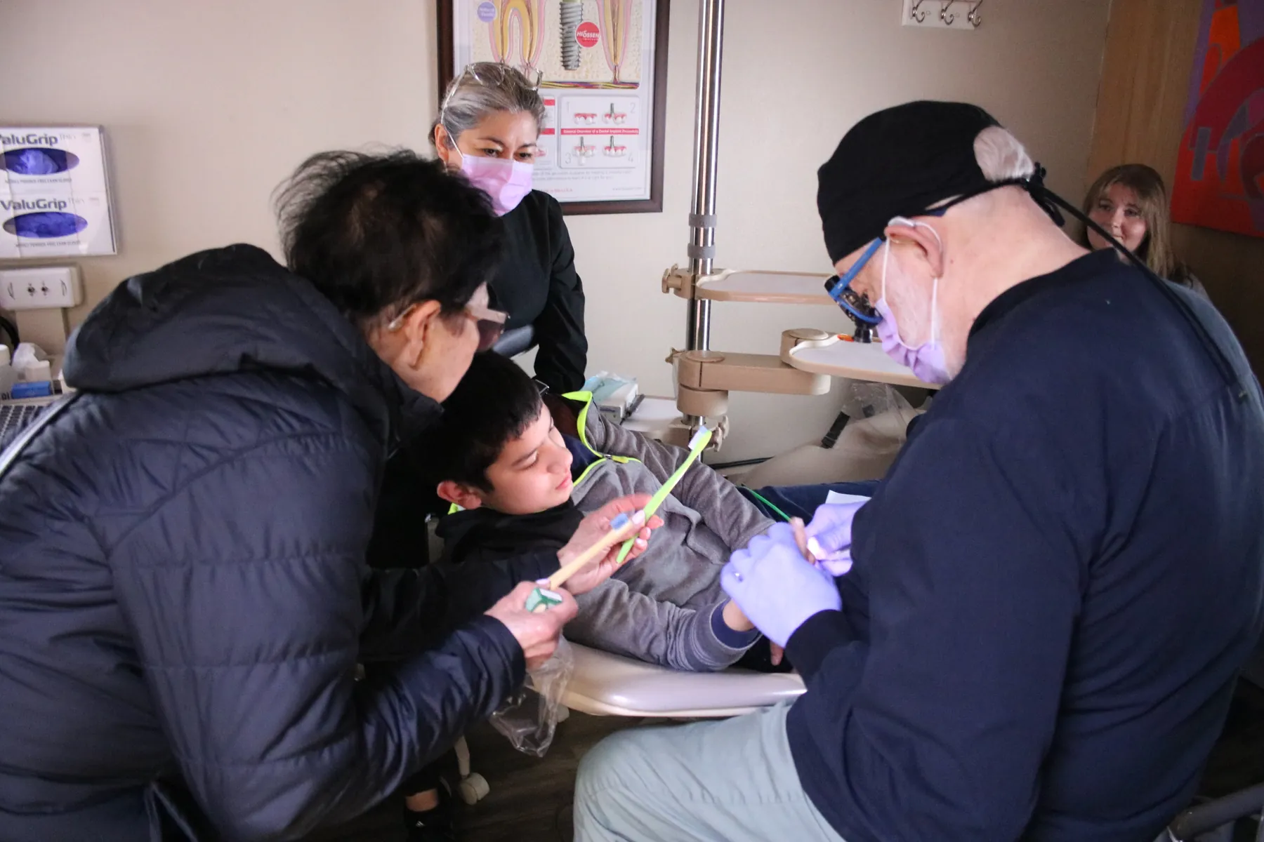 A patient receiving compassionate support during a dental visit