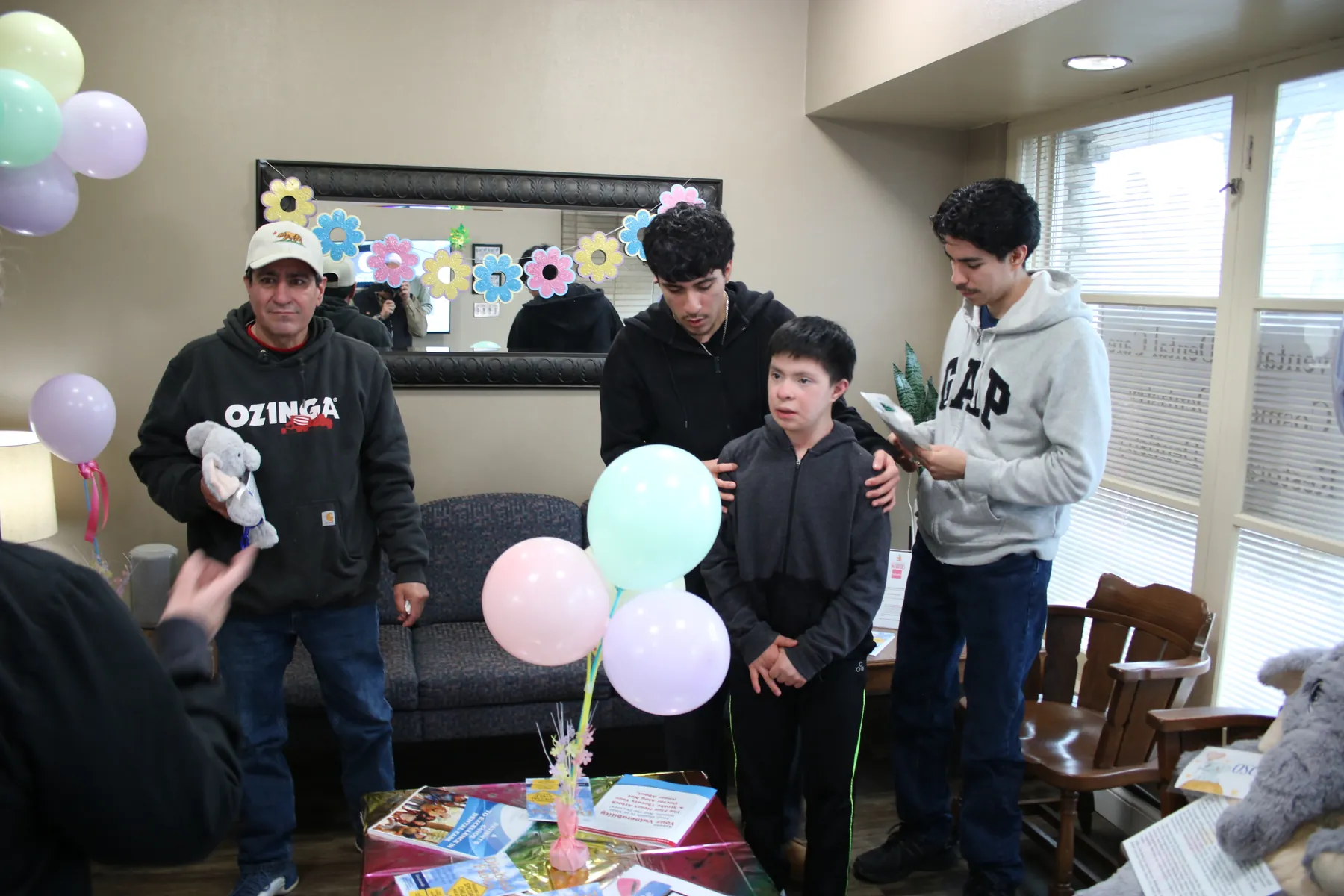 A family welcomed with balloons at Special Needs Day of Dentistry